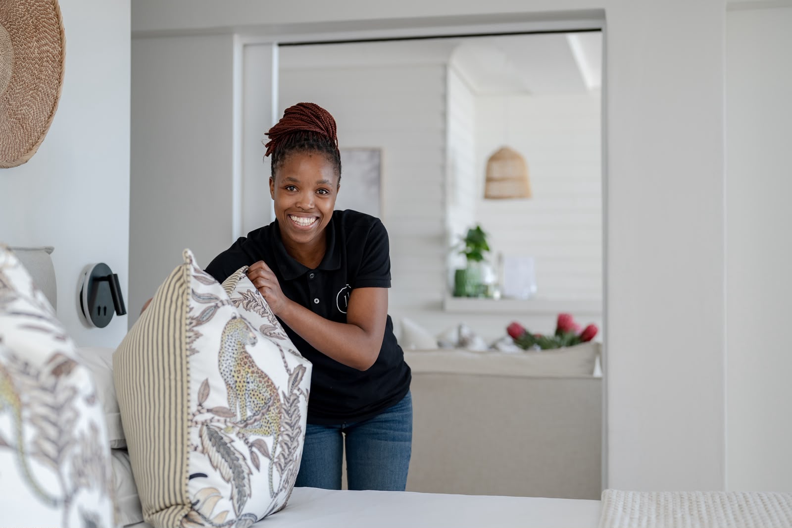 Housekeeper preparing a suite at Eleven Hotel